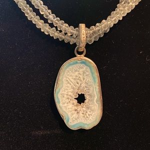 Aquamarine geode with light colored aquamarine chip necklace.